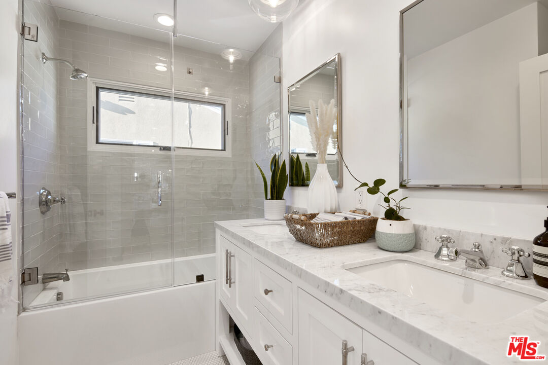 8388 Chase Avenue Los Angeles, CA 90045 - Photo 25 of 30 a bathroom with a tub sink and mirror