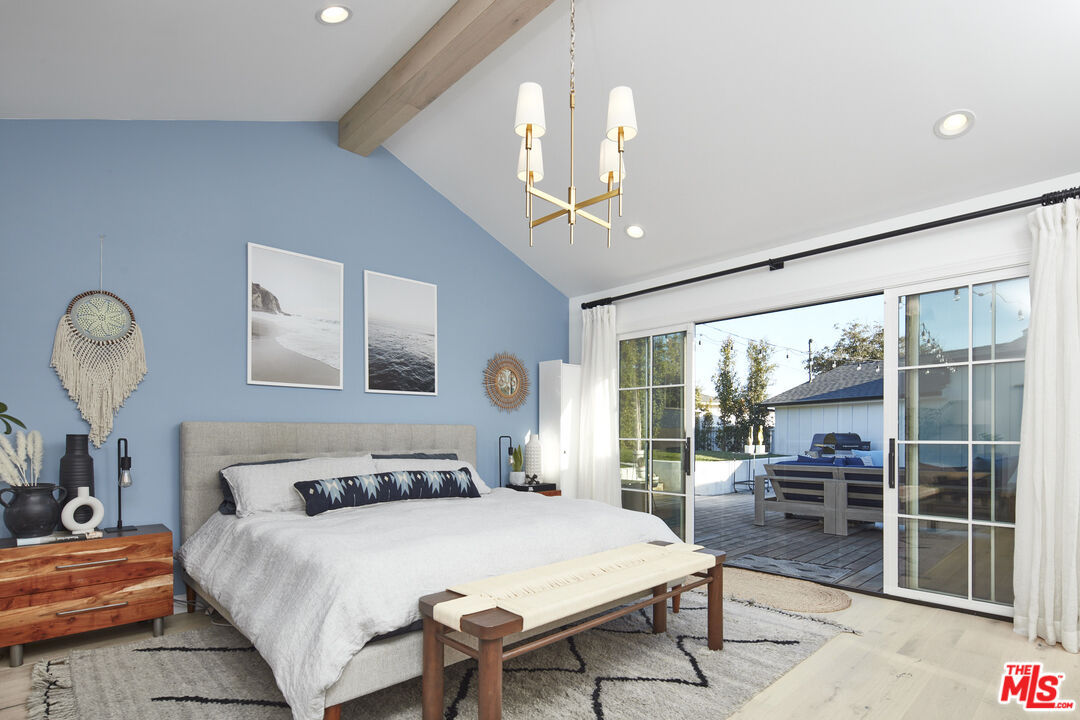 8388 Chase Avenue Los Angeles, CA 90045 - Photo 5 of 30 a bedroom with a large bed and a large window