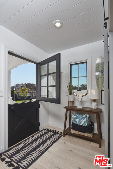 8388 Chase Avenue Los Angeles, CA 90045 - Photo 8 of 30 a living room with a couch and a table