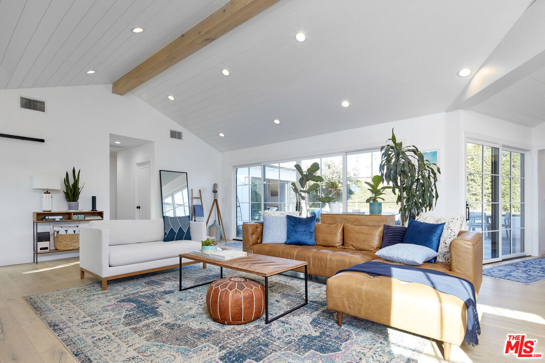 8388 Chase Avenue Los Angeles, CA 90045 - Photo 9 of 30 a living room with furniture and a large window