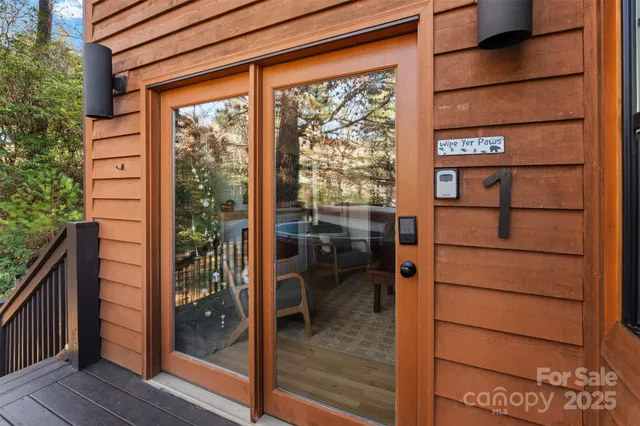 a front view of a house with a large window