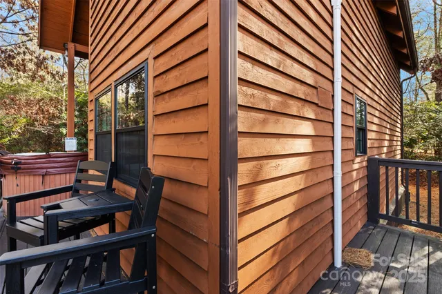 a front view of a house with stairs and a yard