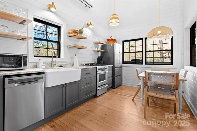 a kitchen with a sink stove and cabinets