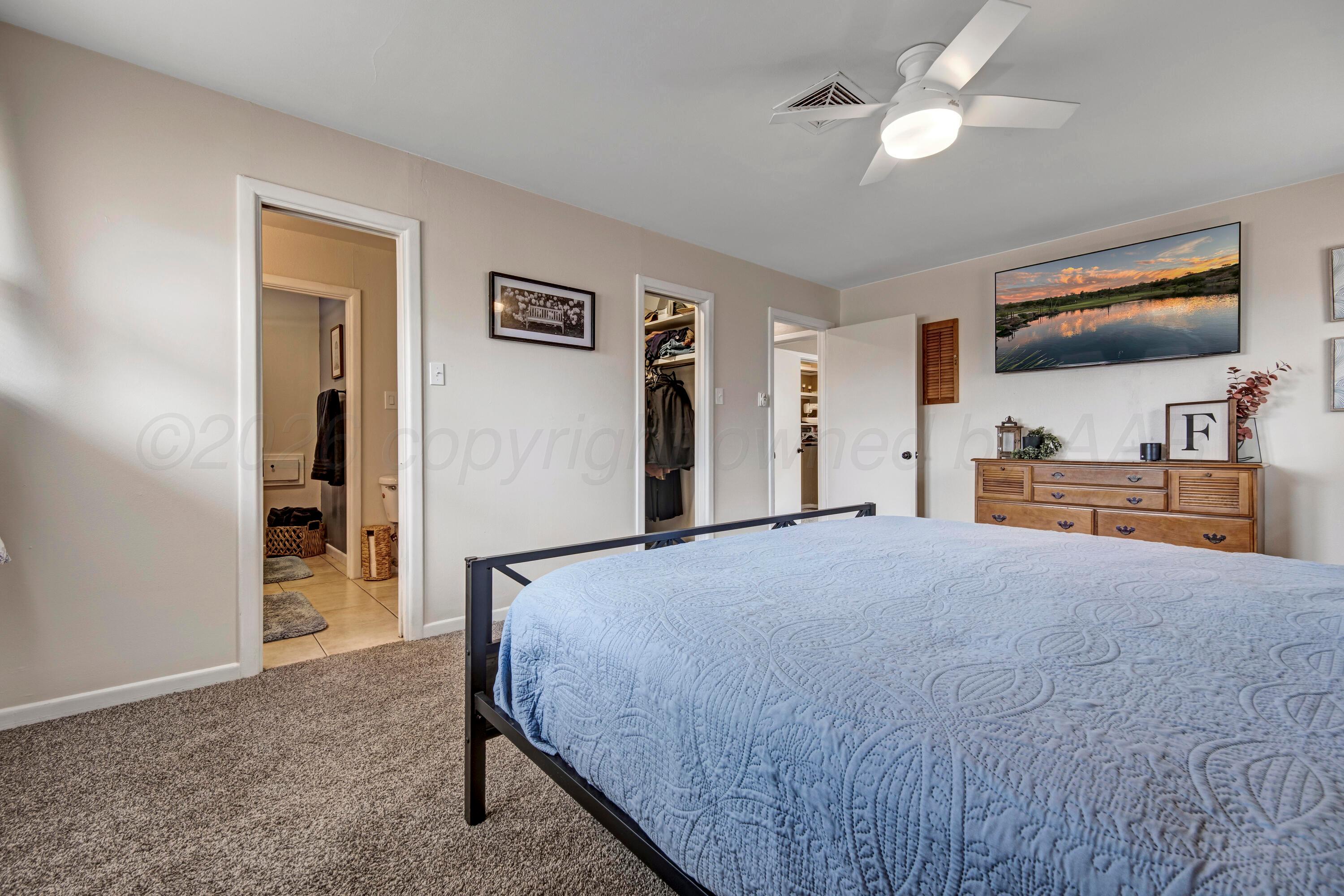 212 Teague Street Borger, TX 79007 - Photo 13 of 30 a bedroom with a bed and a flat screen tv