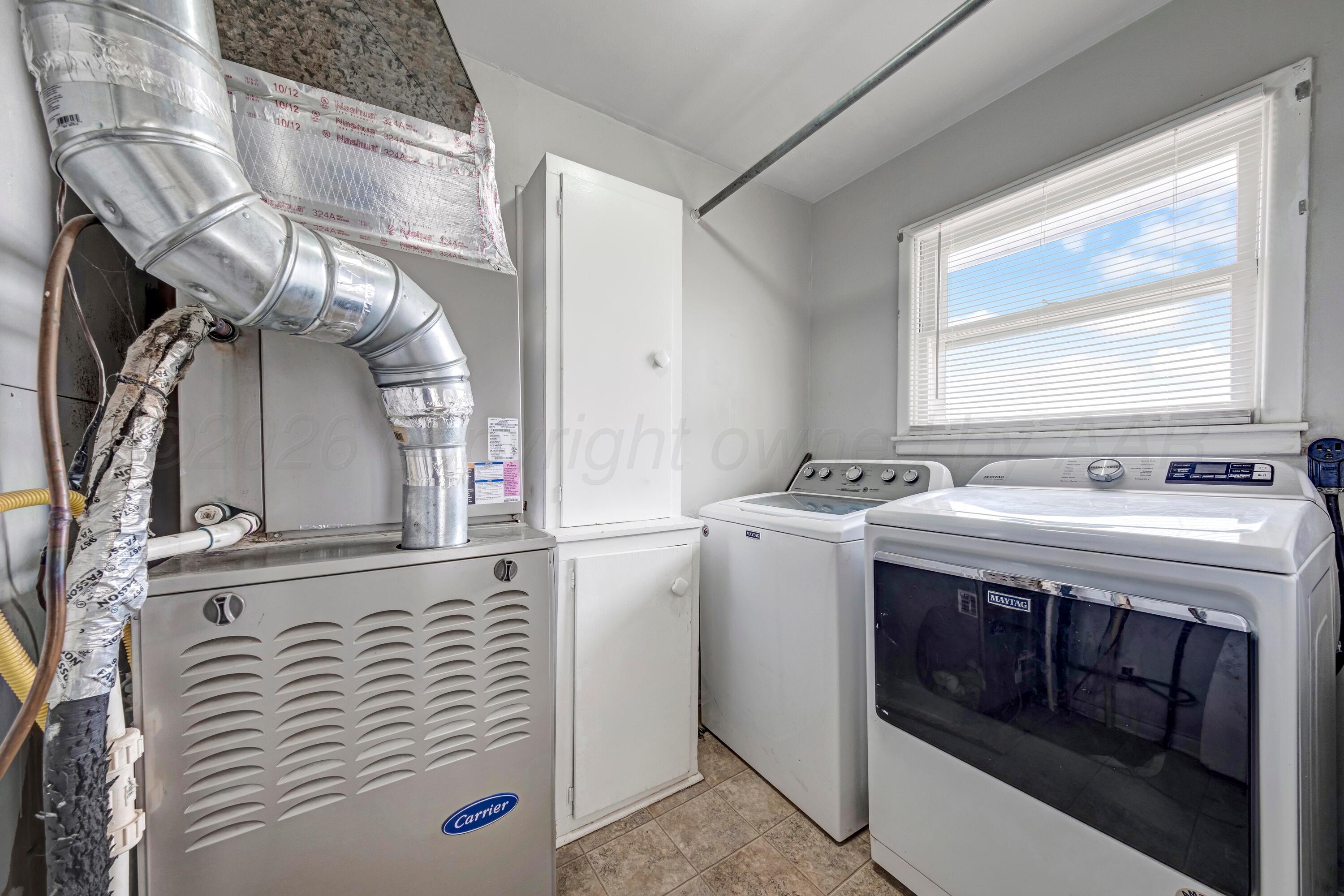 212 Teague Street Borger, TX 79007 - Photo 20 of 30 a bathroom with a sink and a mirror