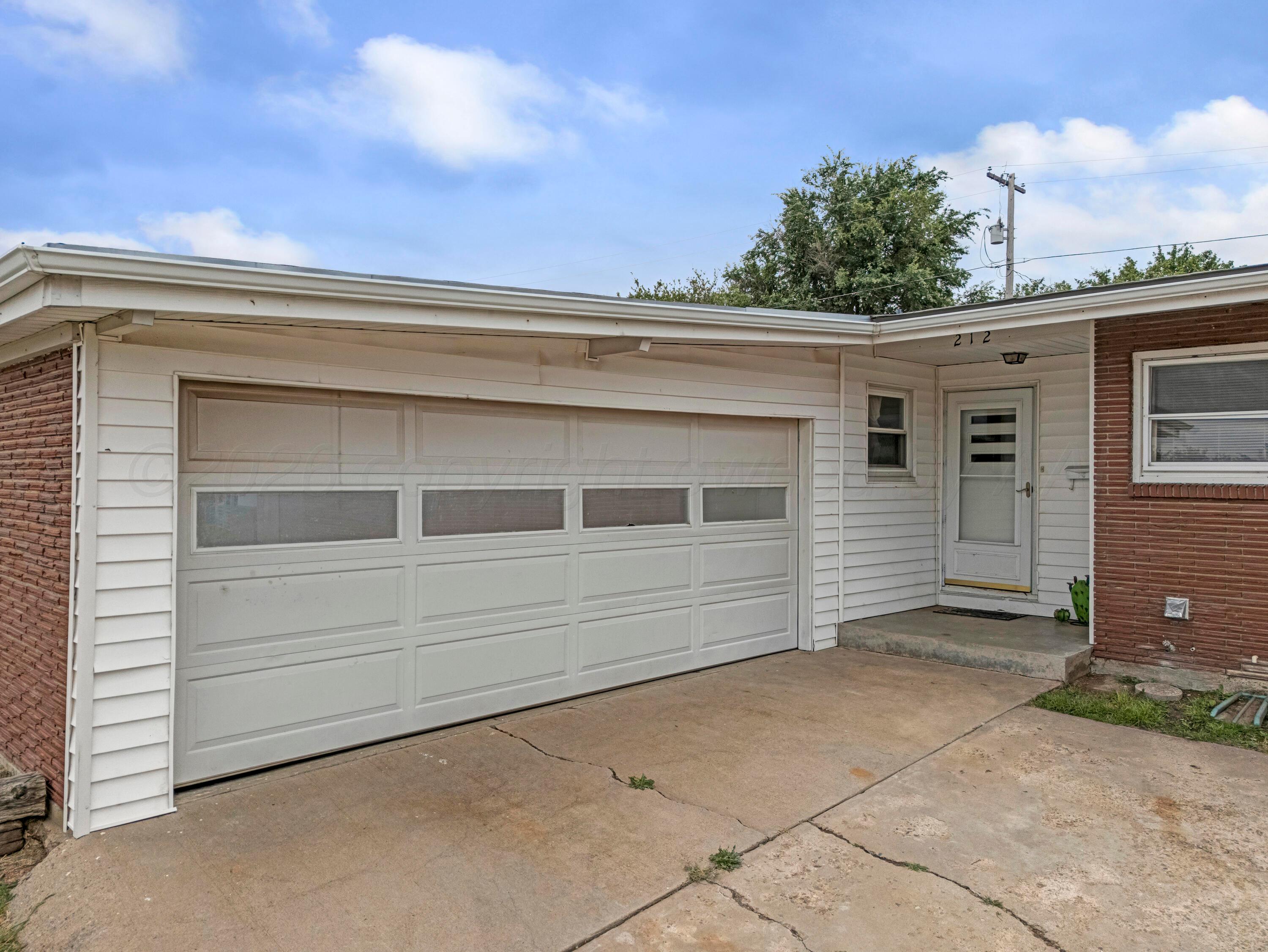 212 Teague Street Borger, TX 79007 - Photo 21 of 30 a view of a house with a garage