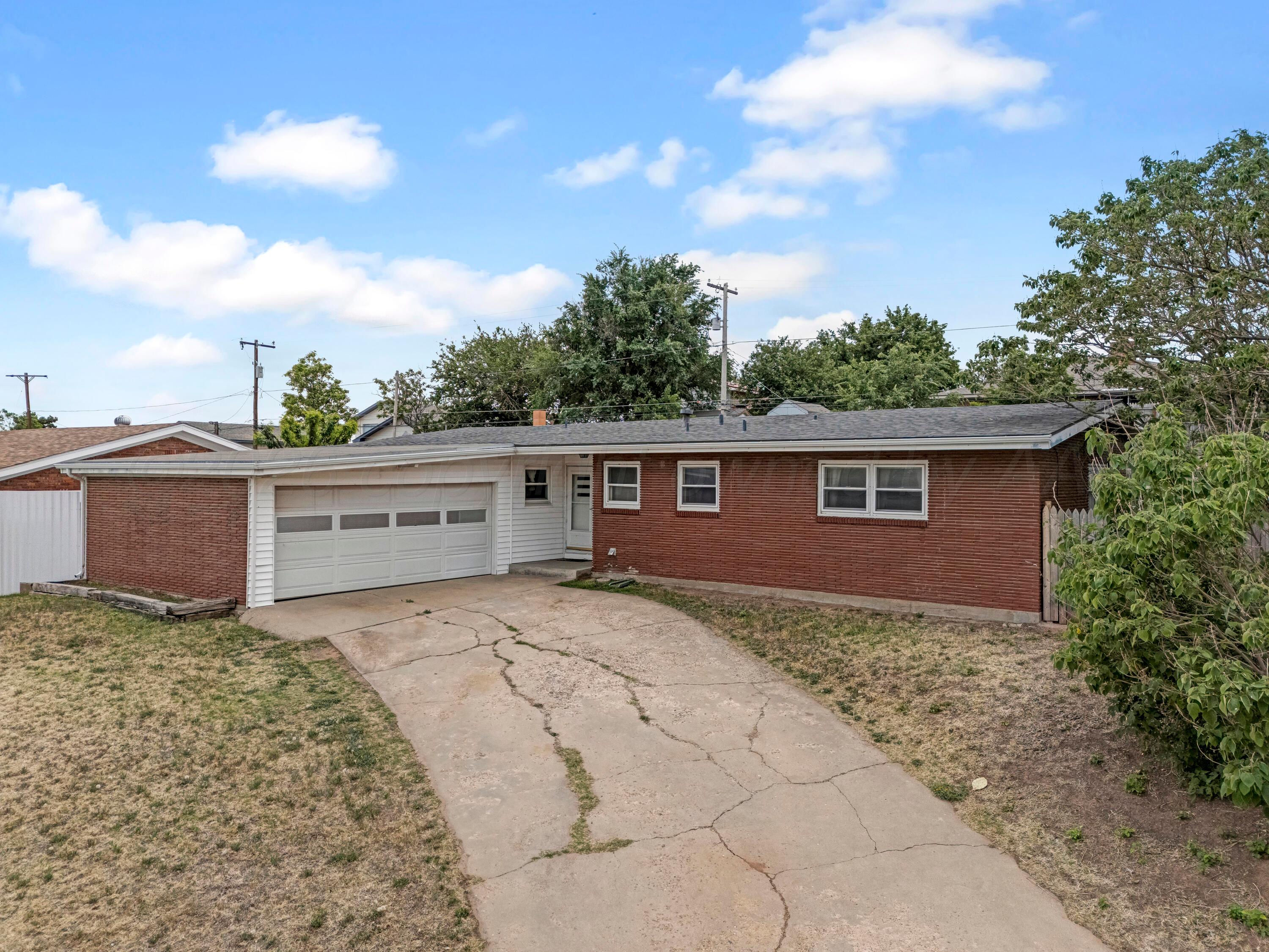 212 Teague Street Borger, TX 79007 - Photo 22 of 30 a view of a house with a yard
