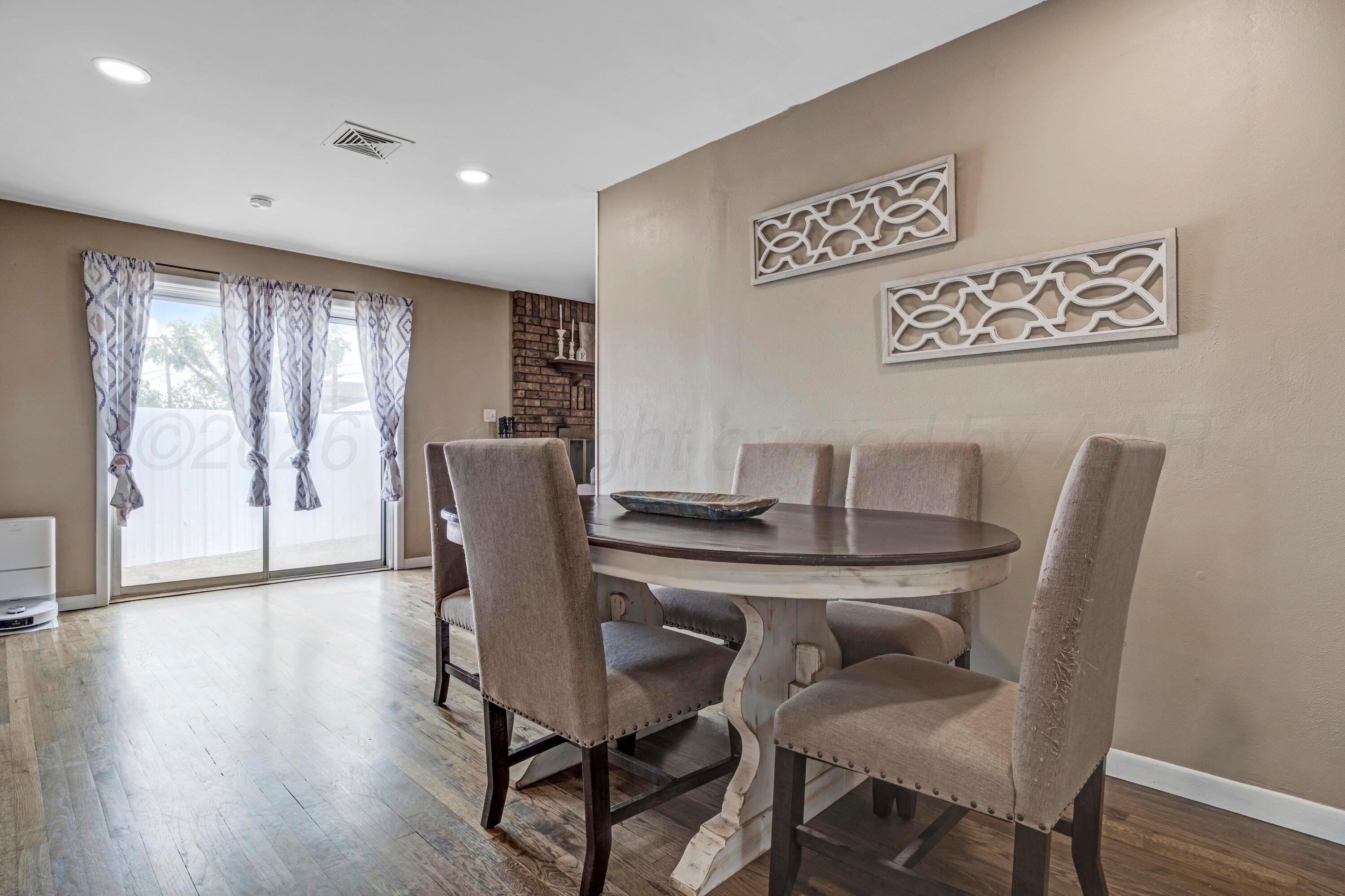 212 Teague Street Borger, TX 79007 - Photo 5 of 30 a view of a dining room with furniture window and wooden floor