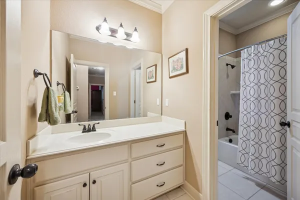 a bathroom with a sink double vanity and a mirror