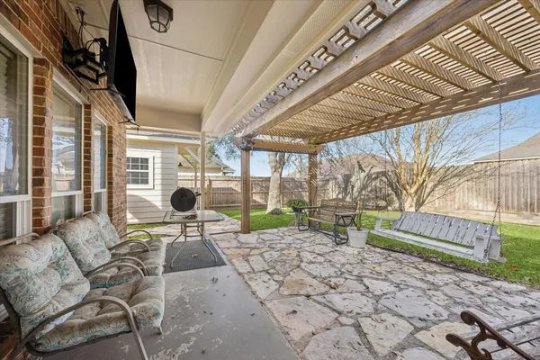 a view of yard with patio