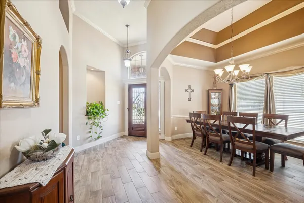 a view of a dining room with furniture and wooden floor