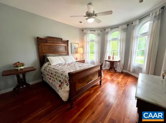 a bed room with a bed and a chair