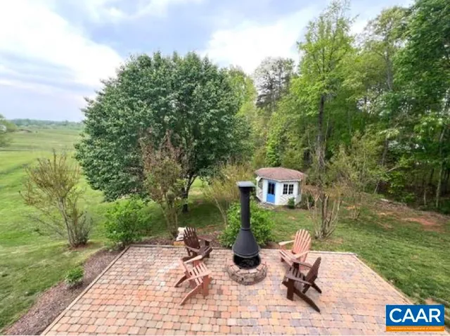 a view of a chairs and table on the garden
