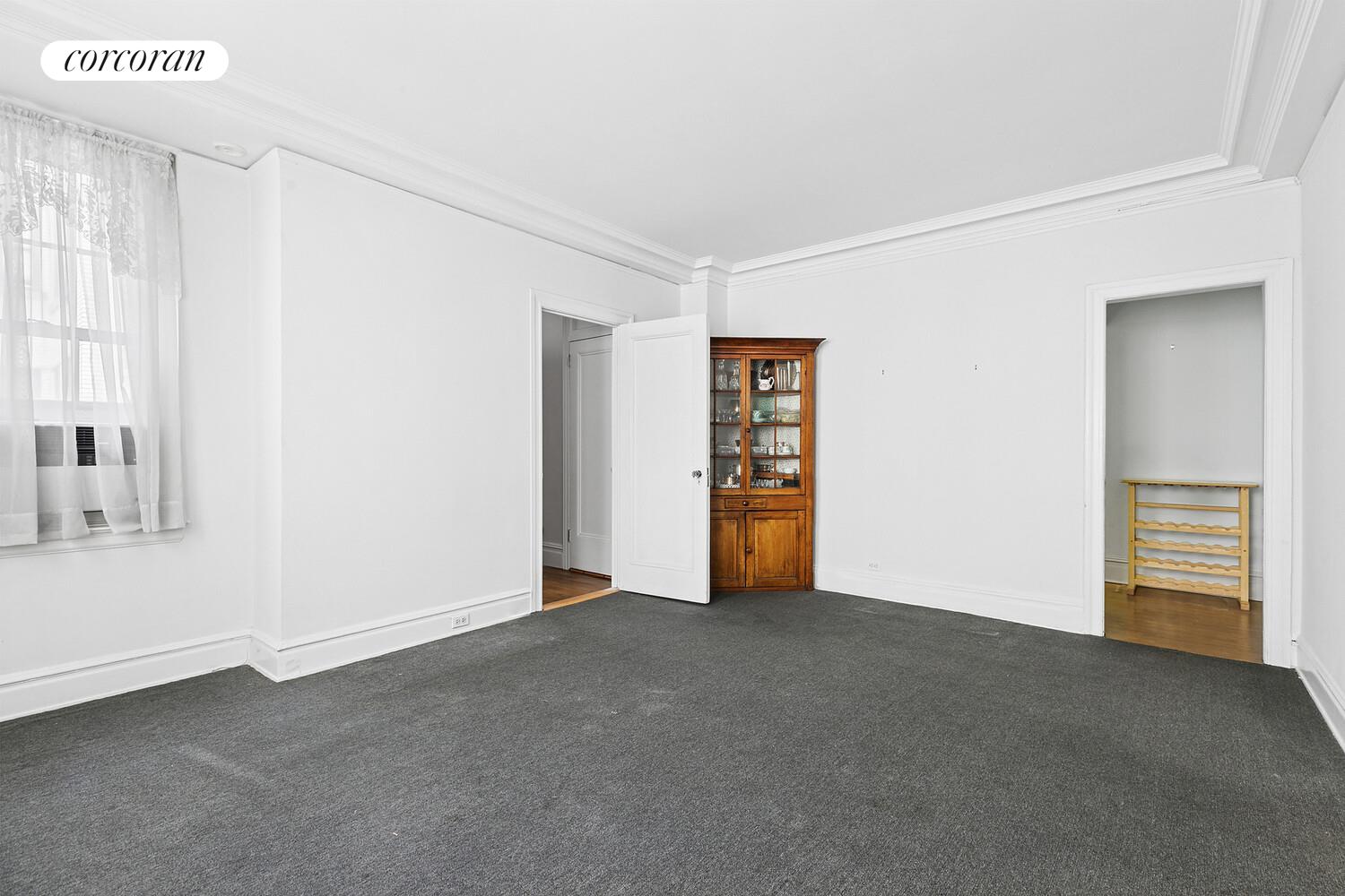17 East 89th Street, Unit 8E Manhattan, NY 10128 - Photo 4 of 9 a view of an empty room with a window