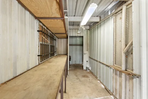 a storage room with lots of wooden furniture