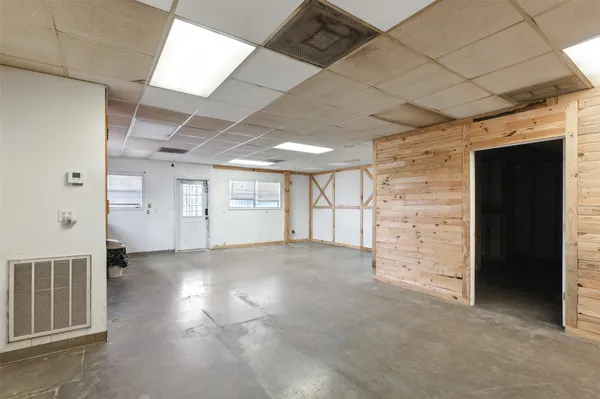 a view of empty room with windows