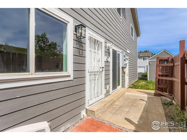 a view of a house with a balcony and door