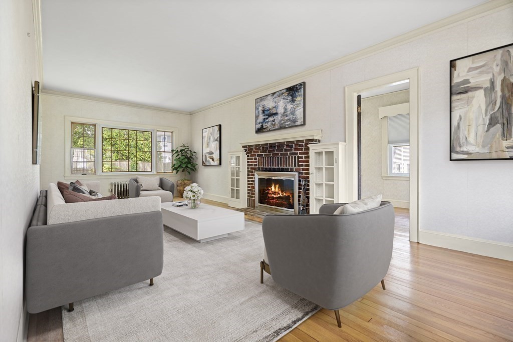 61 Waldeck Road Milton, MA 02186 - Photo 13 of 31 a living room with furniture a large window and a fireplace