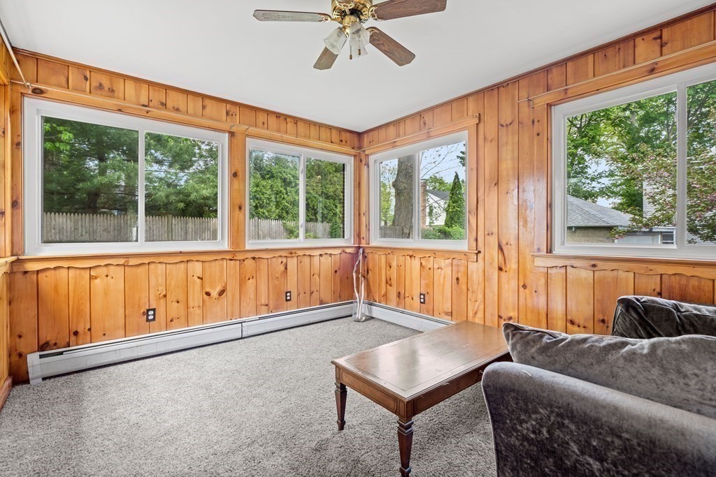 61 Waldeck Road Milton, MA 02186 - Photo 17 of 31 a living room with furniture and a large window