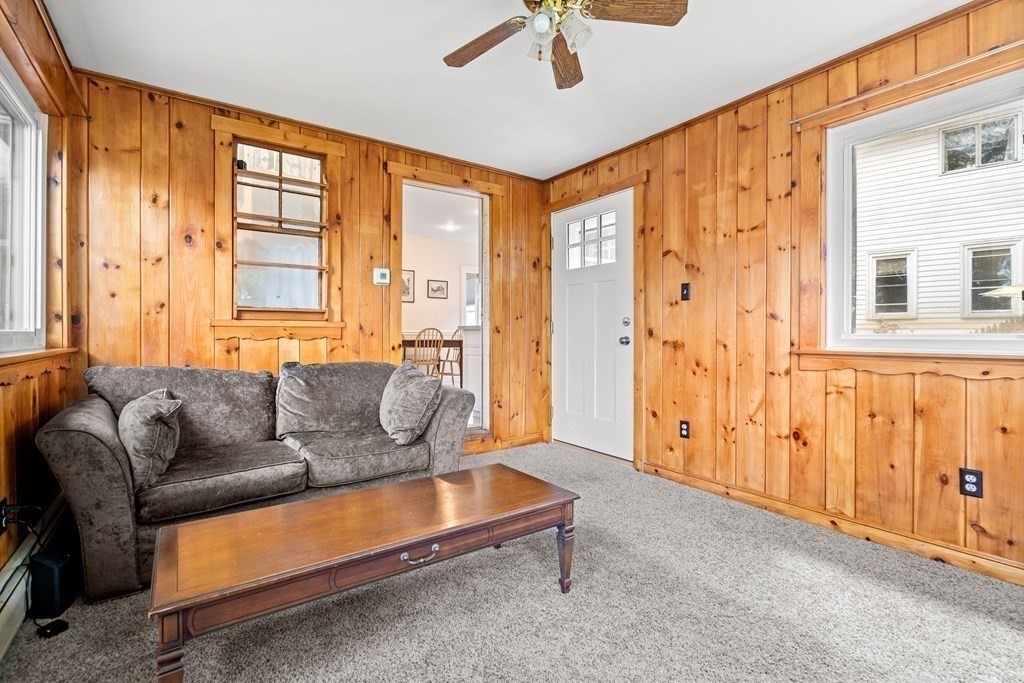 61 Waldeck Road Milton, MA 02186 - Photo 18 of 31 a living room with furniture and a window