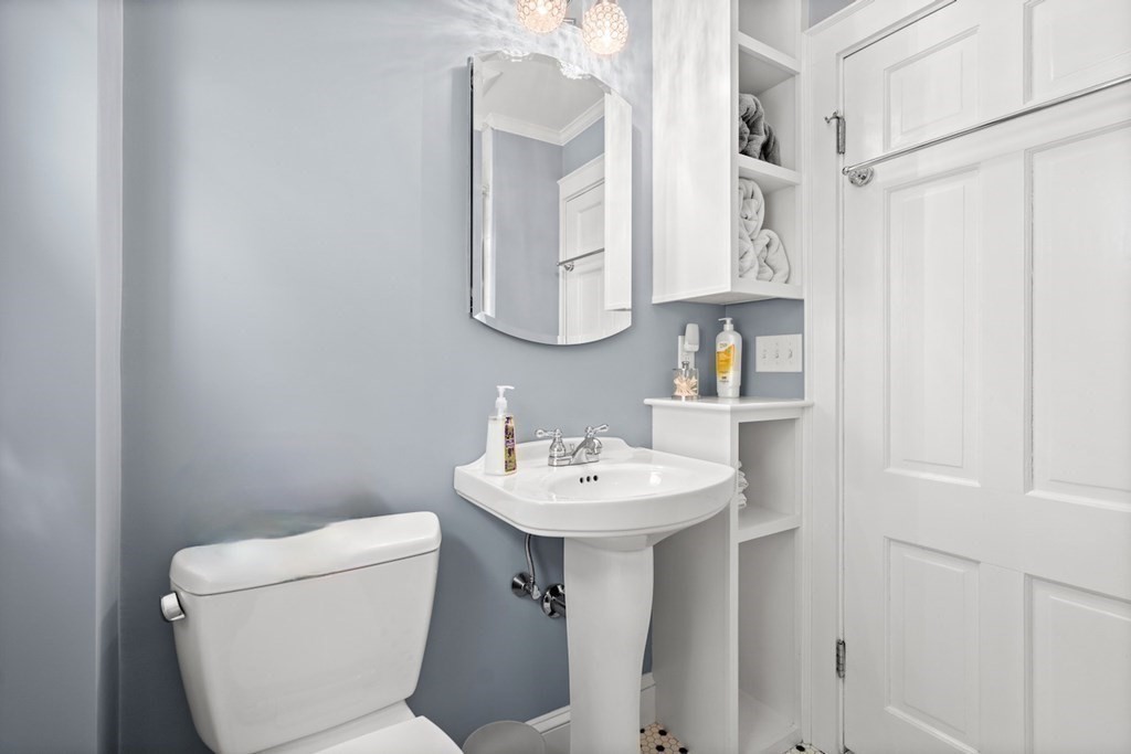 61 Waldeck Road Milton, MA 02186 - Photo 20 of 31 a bathroom with a sink mirror and toilet