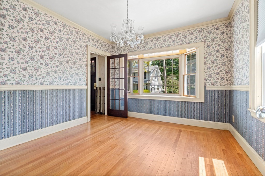 61 Waldeck Road Milton, MA 02186 - Photo 10 of 31 wooden floor in an empty room with a window