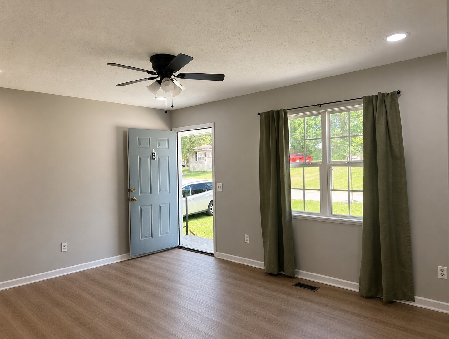 310 Indian Mound Road, Unit B Manchester, TN 37355 - Photo 2 of 7 a view of a livingroom with a chandelier fan and windows