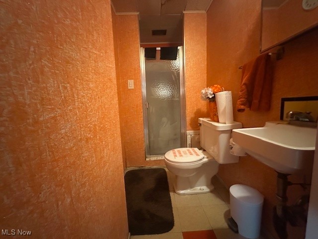 9717 Alexander Road Cleveland, OH 44125 - Photo 11 of 13 Full bathroom with a shower stall and tile patterned flooring