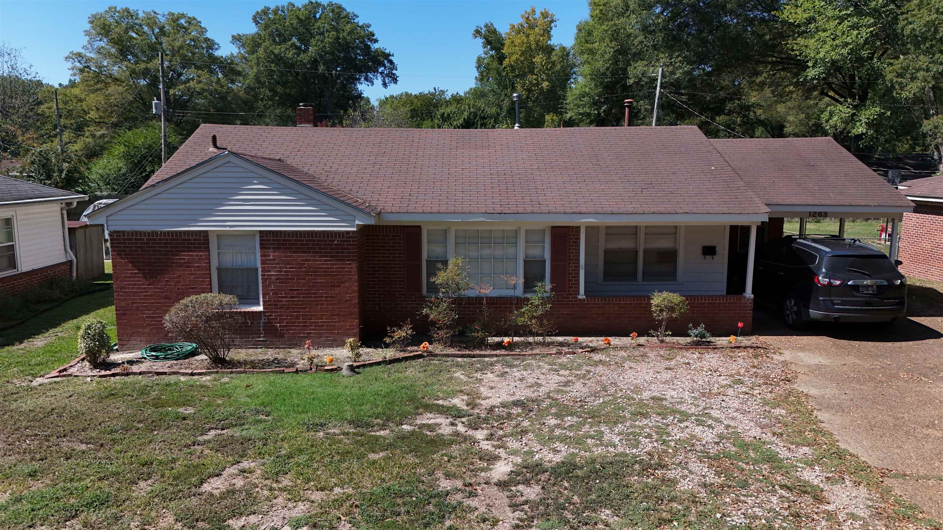 1263 South Perkins Road Memphis, TN 38117 - Photo 1 of 35 a front view of a house with yard and porch