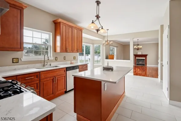 a kitchen with stainless steel appliances a sink stove and refrigerator