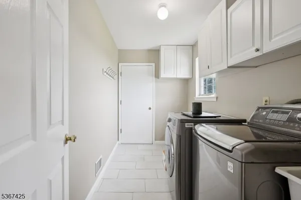 a view of a kitchen with stove and hanging chair