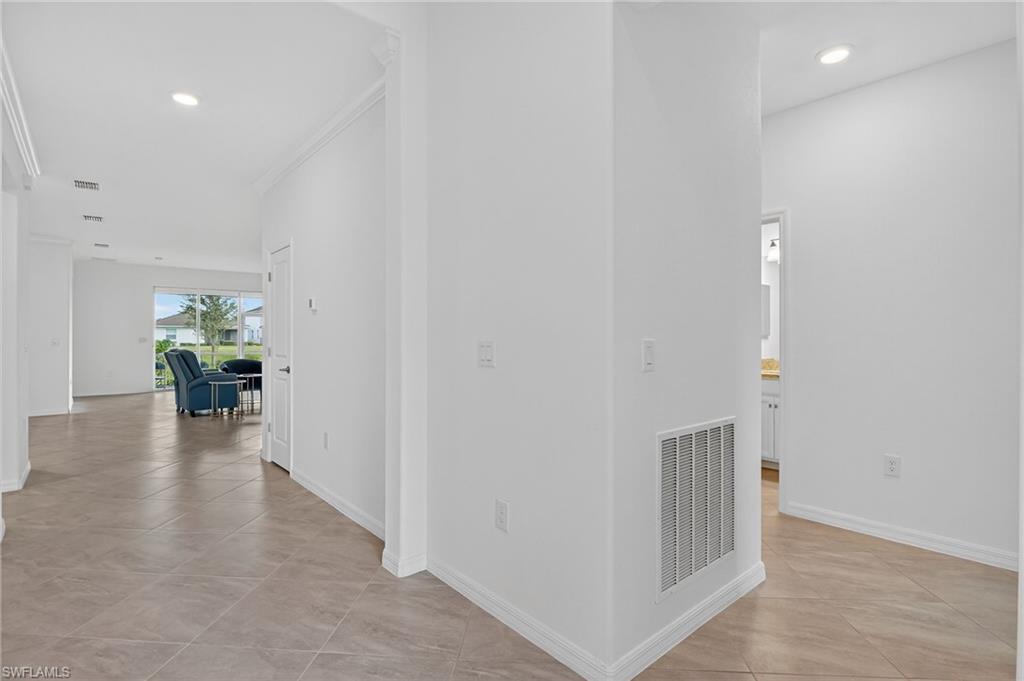 2126 Hamlin Street Naples, FL 34120 - Photo 3 of 38 a view of livingroom with furniture and wooden floor