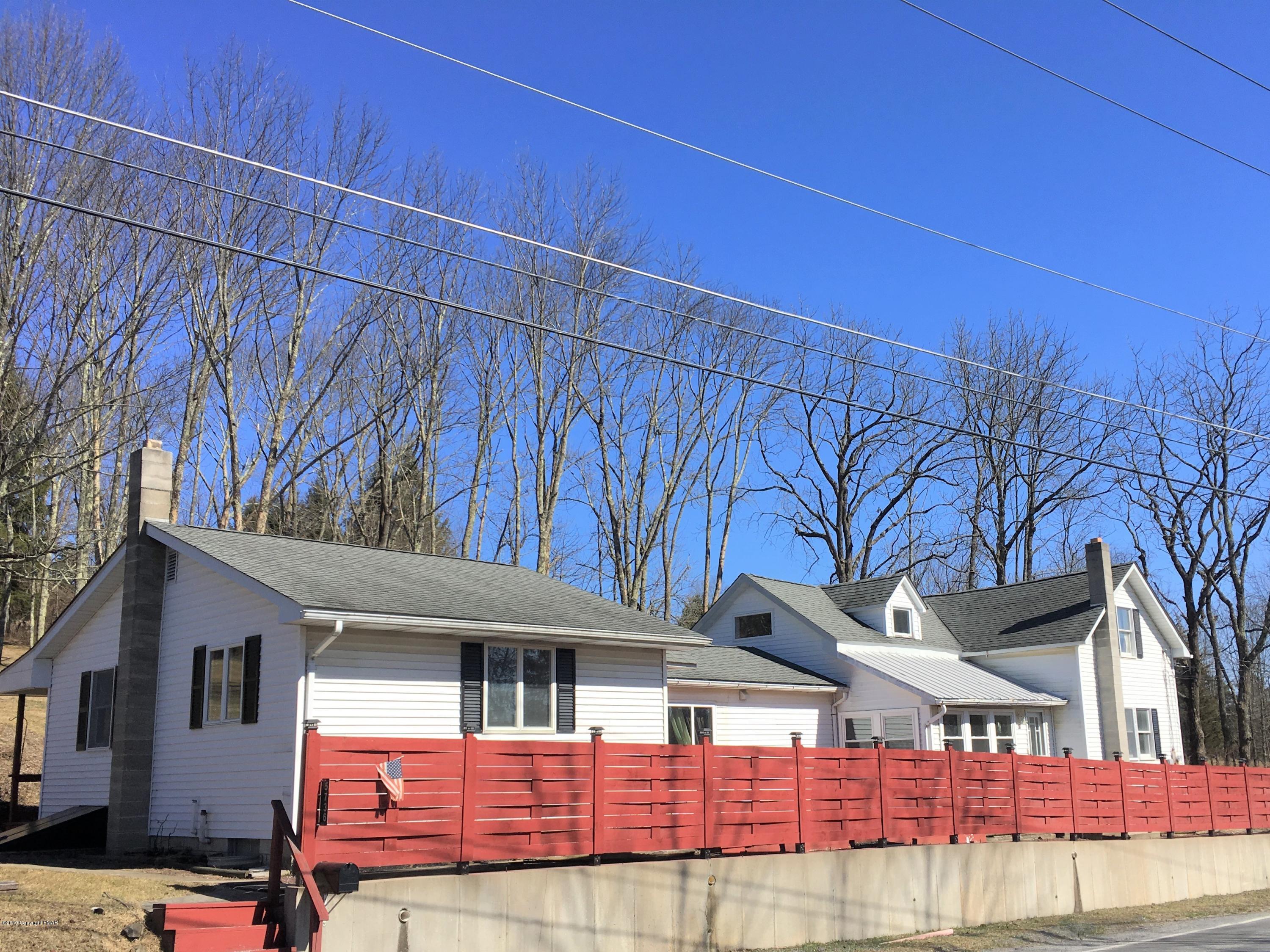 a view of a house with a street