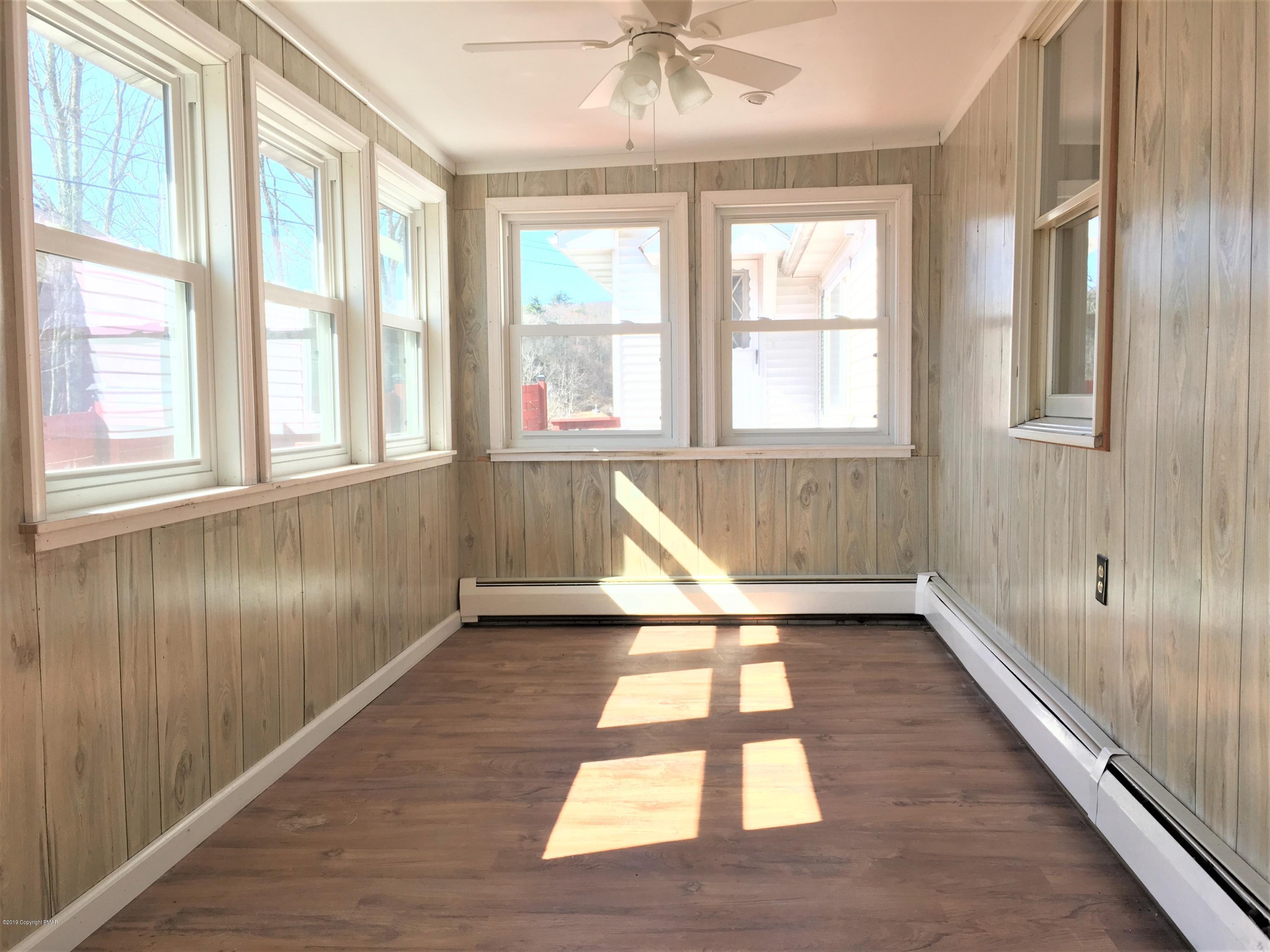 5736 Neola Road Stroudsburg, PA 18360 - Photo 16 of 37 a view of an empty room with a window