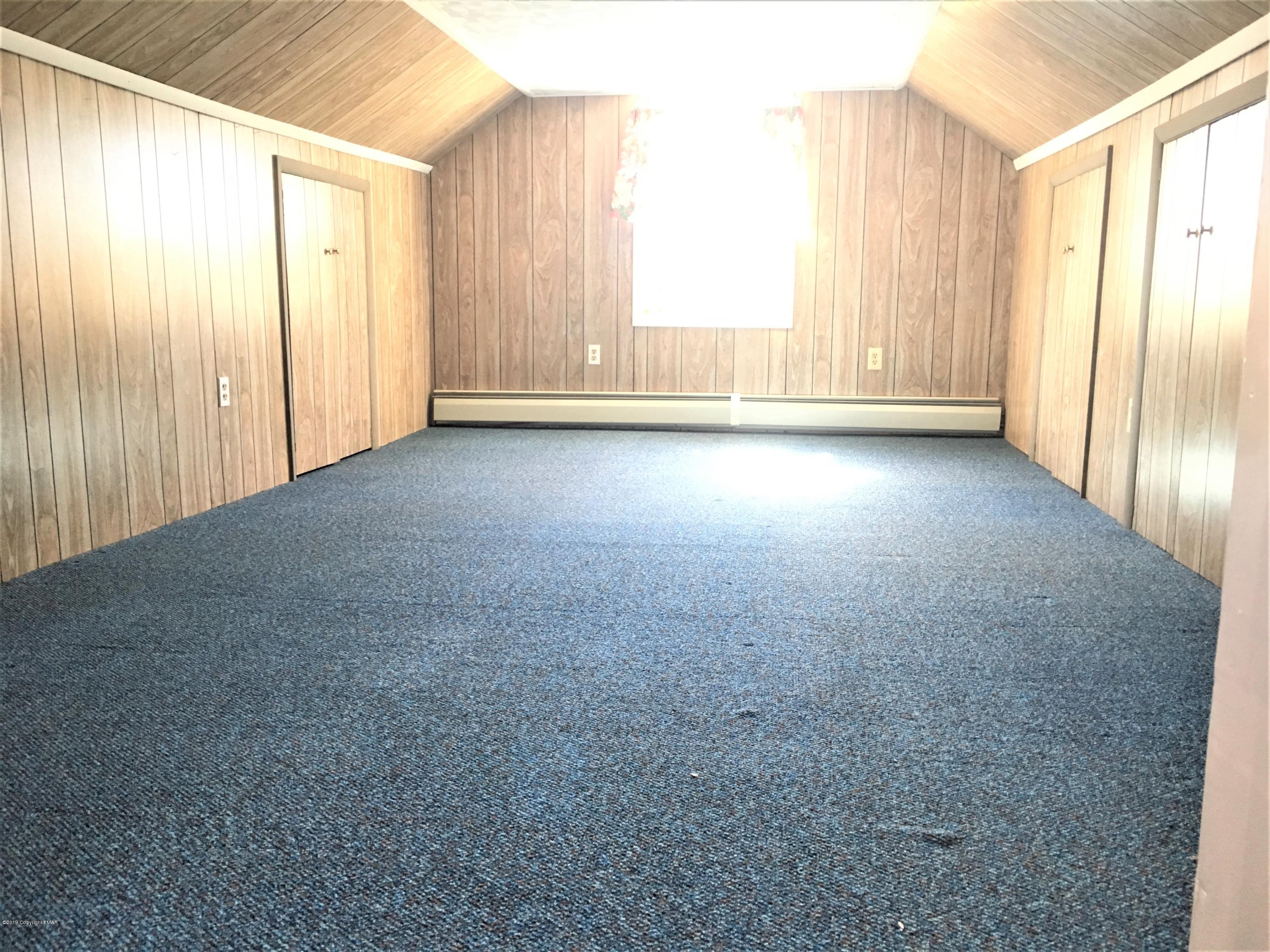 5736 Neola Road Stroudsburg, PA 18360 - Photo 23 of 37 a view of empty room with wooden floor