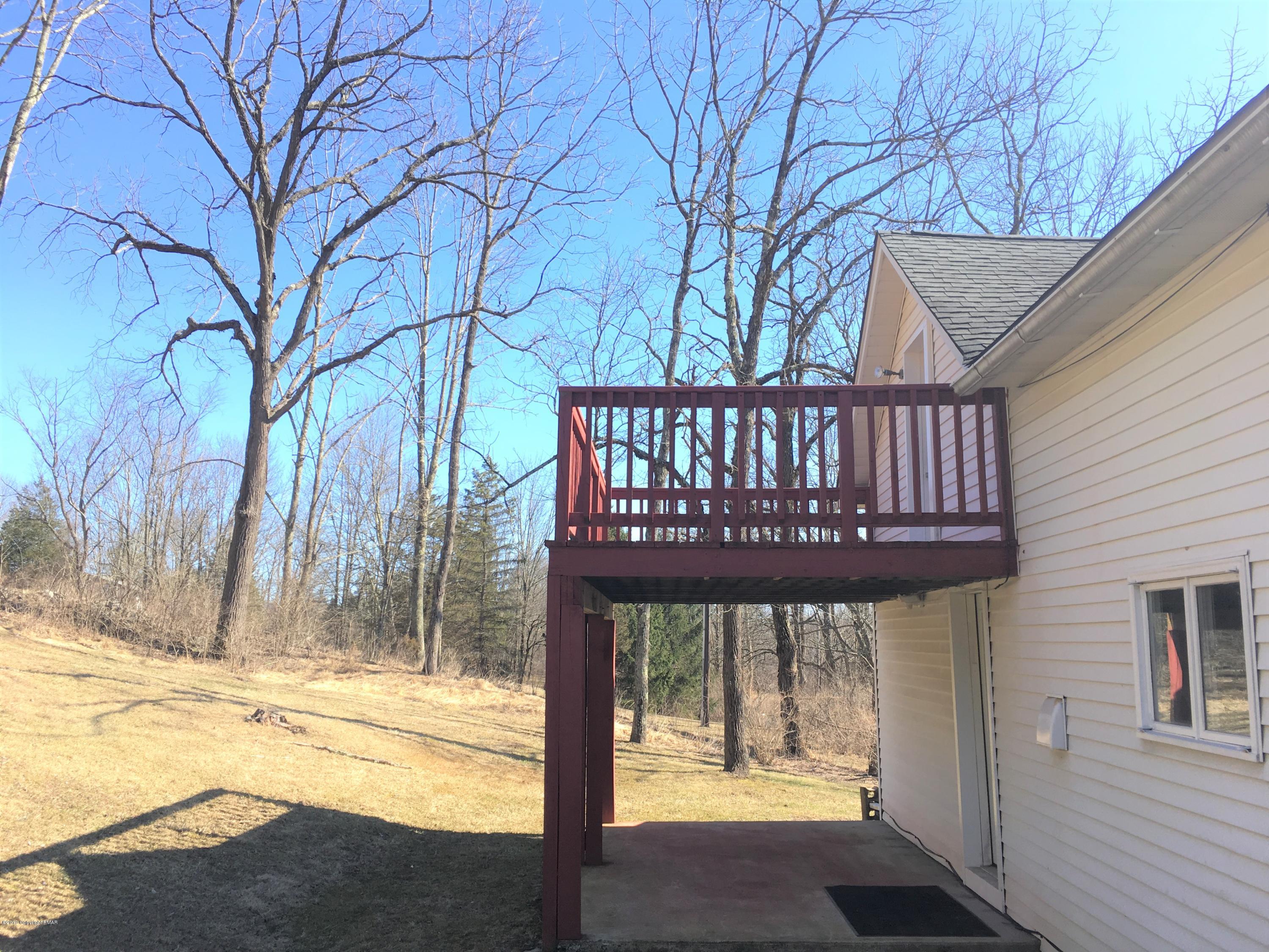 5736 Neola Road Stroudsburg, PA 18360 - Photo 29 of 37 a view of a porch with a yard