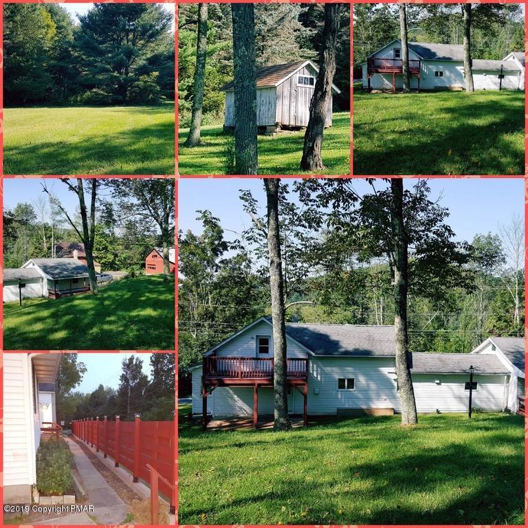 5736 Neola Road Stroudsburg, PA 18360 - Photo 32 of 37 a view of a house with a yard and potted plants