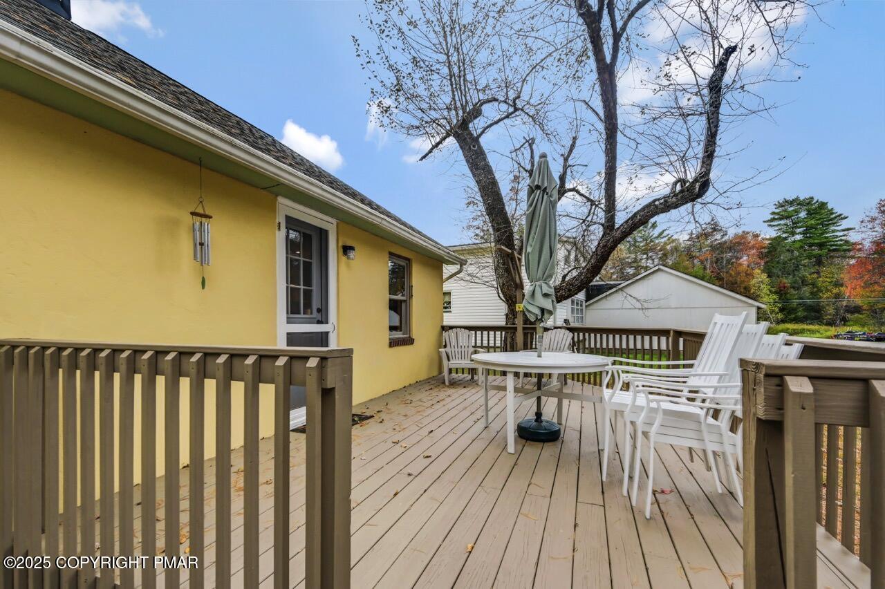 229 3rd Street Pocono Pines, PA 18350 - Photo 18 of 21 a view of balcony with wooden floor and fence