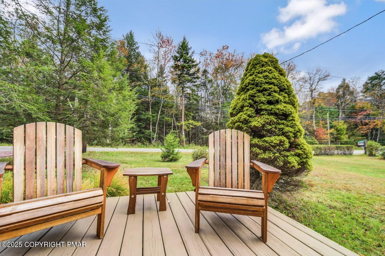 229 3rd Street Pocono Pines, PA 18350 - Photo 19 of 21 a view of a two chairs with table in the balcony