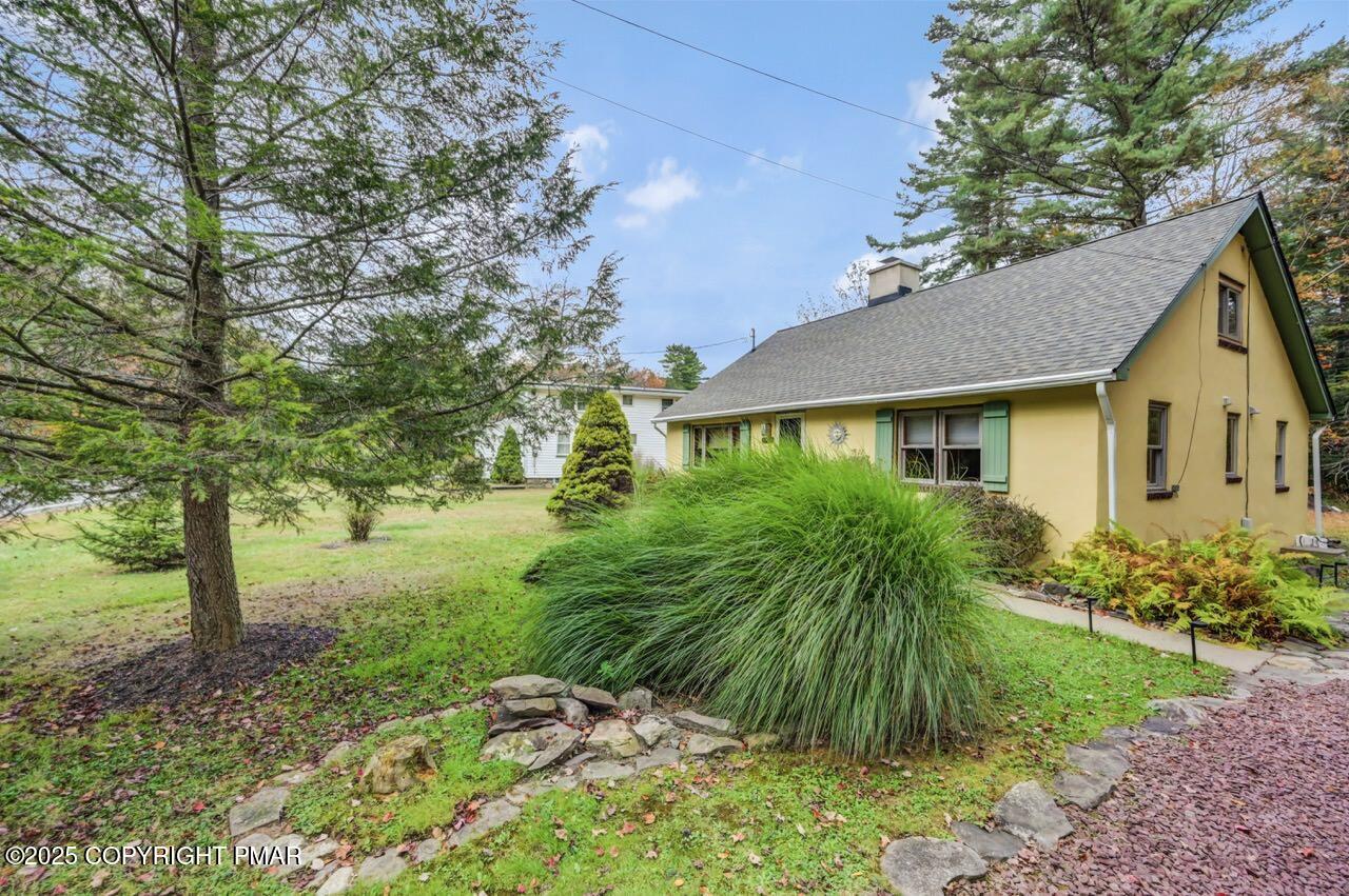 229 3rd Street Pocono Pines, PA 18350 - Photo 2 of 21 a view of a house with a yard