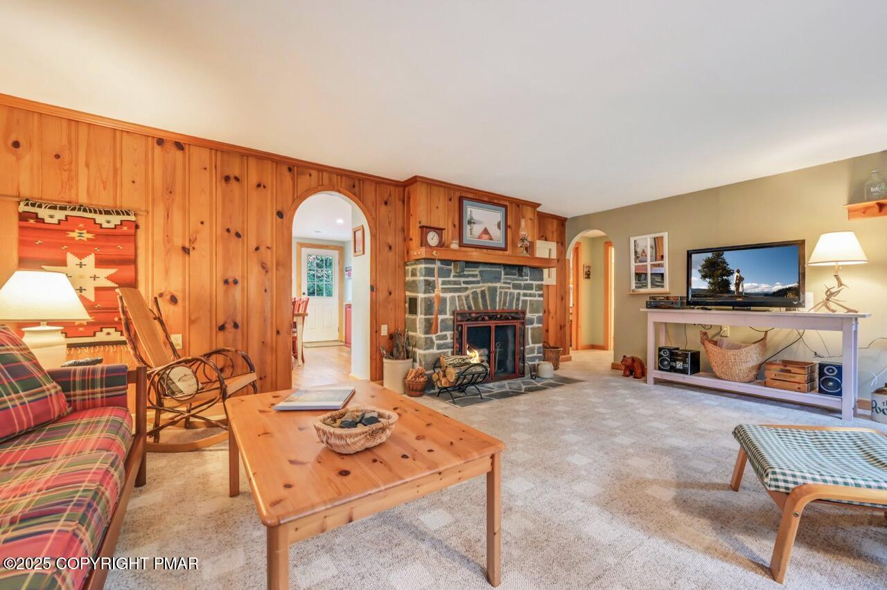 229 3rd Street Pocono Pines, PA 18350 - Photo 5 of 21 a living room with furniture a fireplace and a flat screen tv