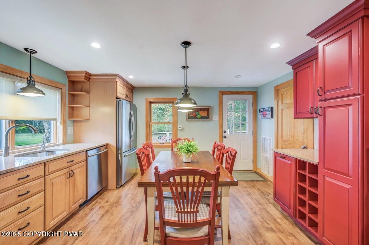 229 3rd Street Pocono Pines, PA 18350 - Photo 6 of 21 a view of a dining room with furniture window and wooden floor