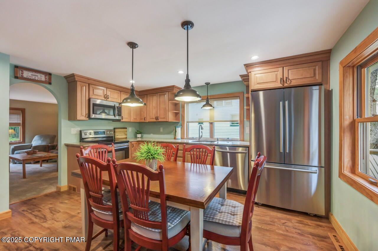 229 3rd Street Pocono Pines, PA 18350 - Photo 7 of 21 a view of a dining room with furniture window and wooden floor