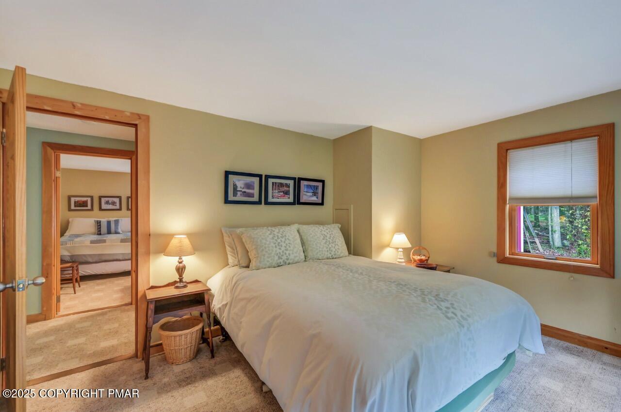 229 3rd Street Pocono Pines, PA 18350 - Photo 10 of 21 a bedroom with a bed and a painting on the wall