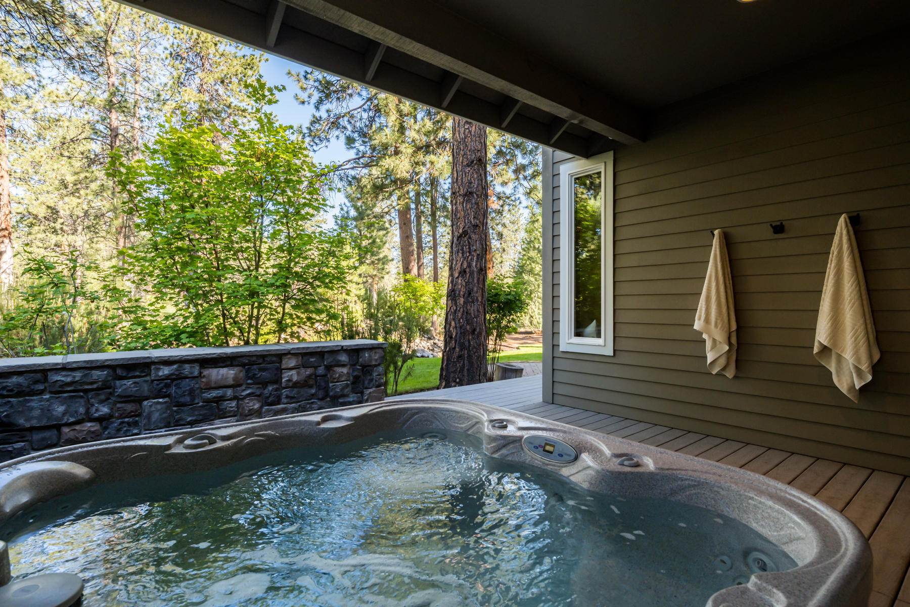 60819 Currant Way Bend, OR 97702 - Photo 33 of 44 Relaxing hot tub is outside Primary Suite and accessible