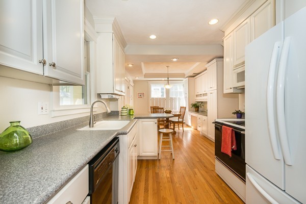 20 Symmes Road Winchester, MA 01890 - Photo 9 of 26 a kitchen with stainless steel appliances granite countertop a sink a stove and a wooden floors