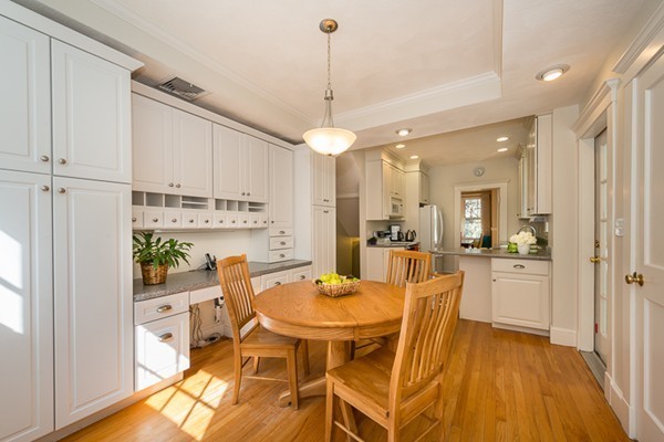 20 Symmes Road Winchester, MA 01890 - Photo 10 of 26 a dining room with stainless steel appliances furniture a rug and a kitchen view