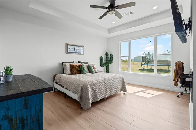 a bedroom with a large bed and a window