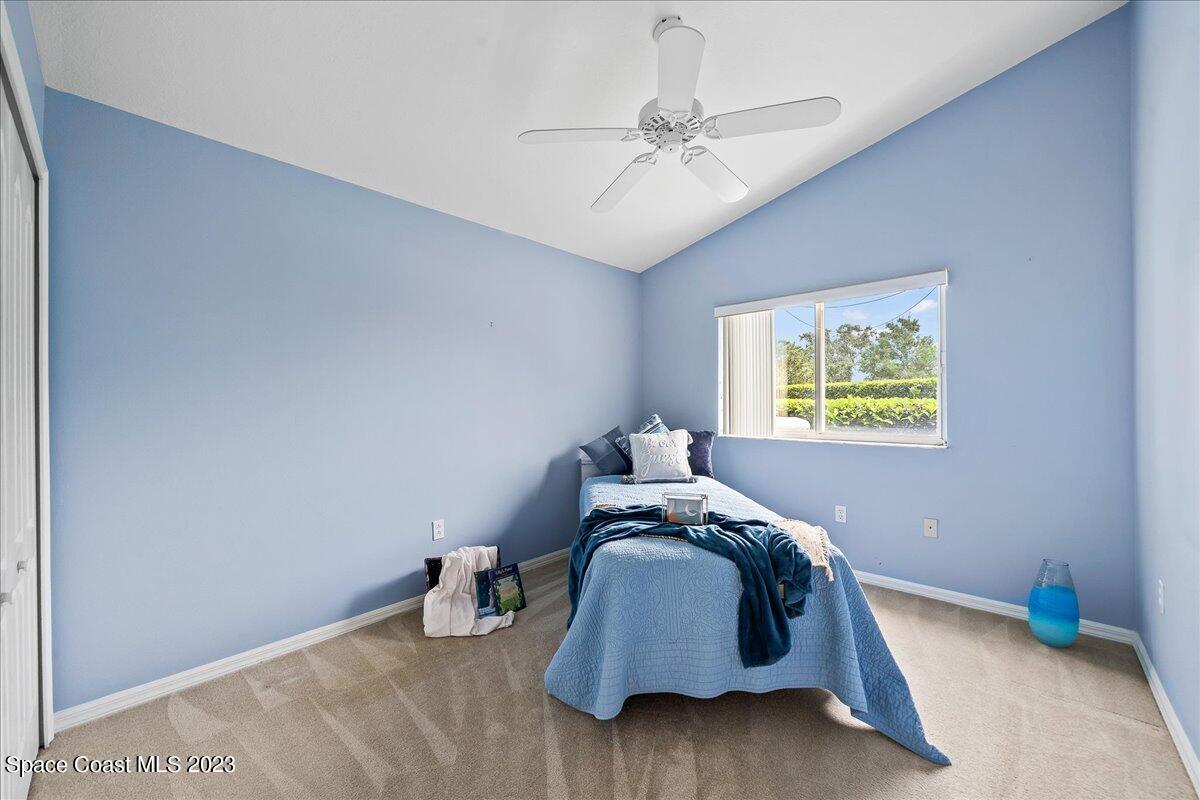 1643 Keys Gate Drive Melbourne, FL 32940 - Photo 24 of 43 a bedroom with bed and a window
