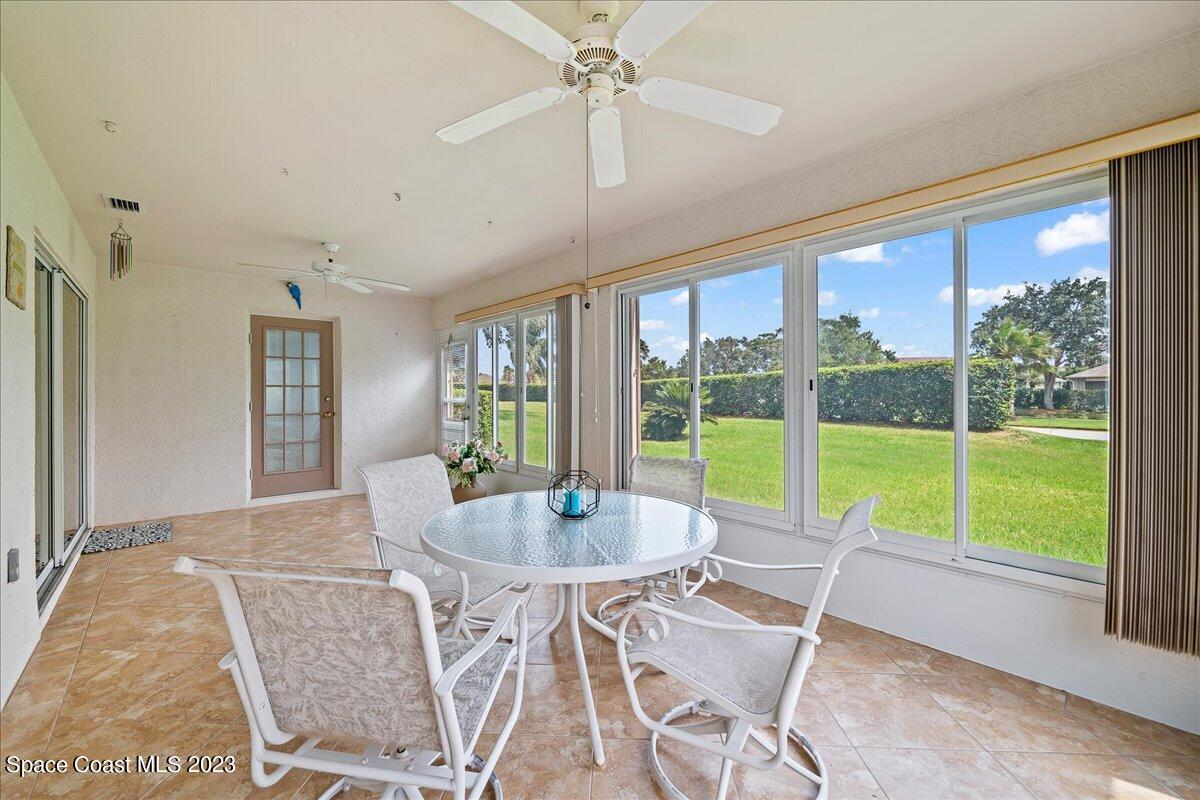 1643 Keys Gate Drive Melbourne, FL 32940 - Photo 29 of 43 a dining room with furniture window and outside view